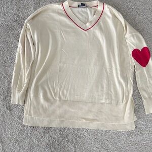 Studio Cream V-Neck Sweater with Red Heart Accent